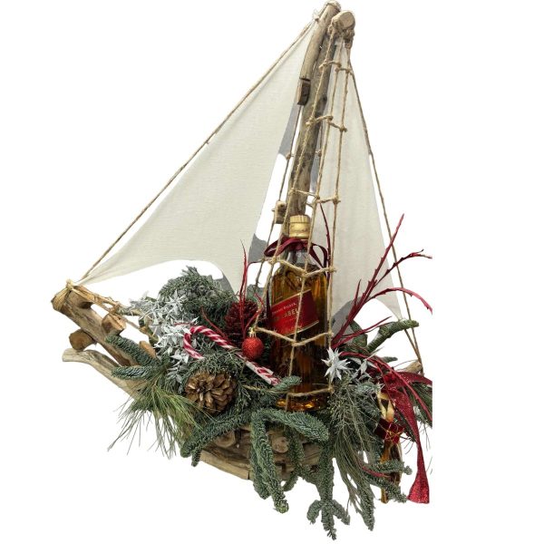 christmas-composition-home-decoration-in-boat-with-whiskey